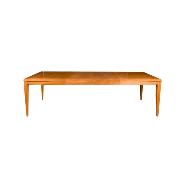 Stunning blonde dining table designed by Ethan Allen. Features a beautiful sophisticated design. Raised over four tapered...