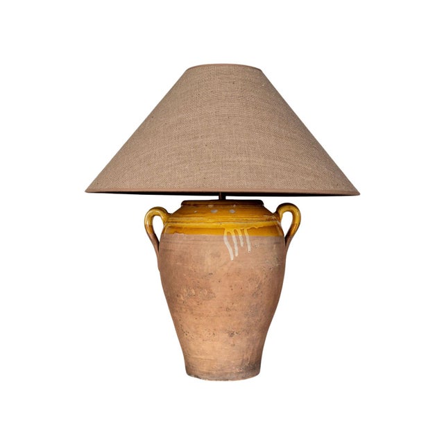 Decorative table lamp. Vase-shaped base with two handles. Dip-glaze finish.