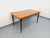 Vintage rectangular dining table from the 1950s/60s, in teak, rectangular top with rounded edges, with two integrated...