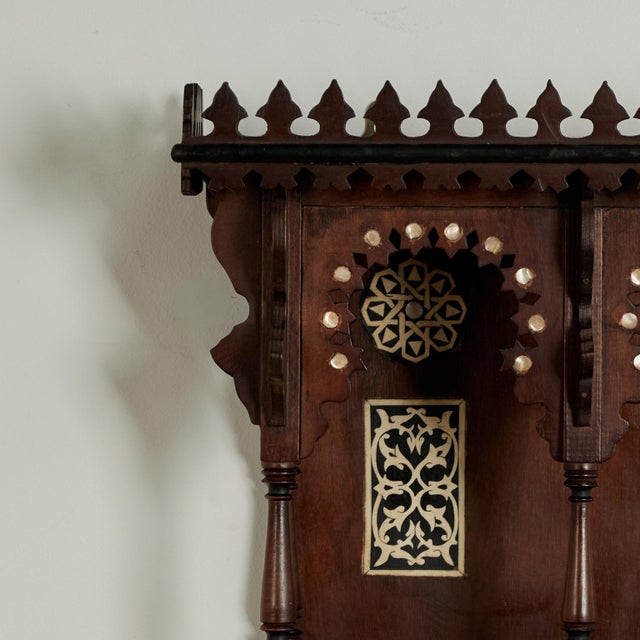 Impressive 19th century Moroccan wall bracket having a shelf on the top with a parapet over two Moorish arches with turned...
