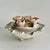 A delicate vintage Capodimonte-style porcelain lidded bowl, richly adorned with hand-sculpted pink roses and green...