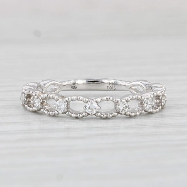 Gemstone Information: - Natural Diamonds - Total Carats - 0.15ctw Cut - Round Brilliant Color - G - H Clarity - VS2 - SI1...