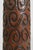 Vintage ceramic table lamp featuring a tall bottle-form silhouette with hand-carved spiral relief and a rich reddish-brown...