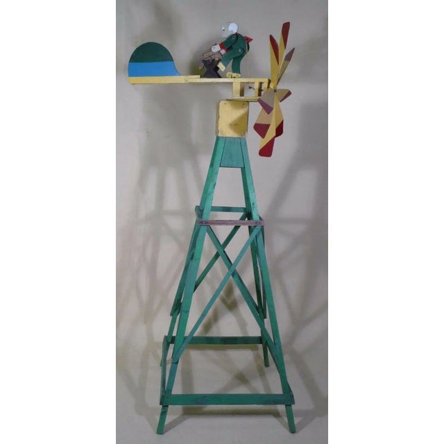 Late 19th-early 20th century Impressive charming American Folk Art original polychrome whirligig of a man sawing wood,...