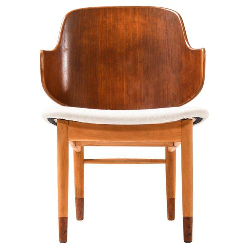 This rare shell easy chair was designed by ib kofod-larsen and produced by the danish cabinetmaker christensen & larsen in...