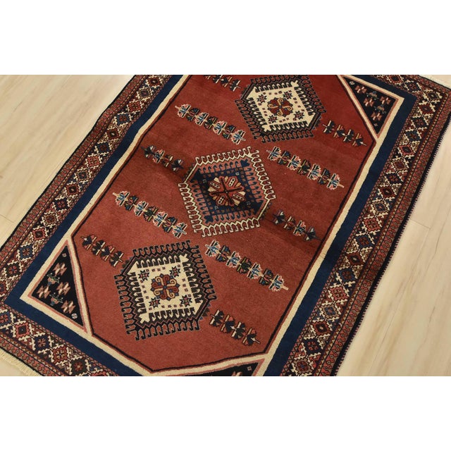 An authentic vintage tribal Yalameh rug hand-knotted with fine wool and natural dyes. This intricately woven rug features...