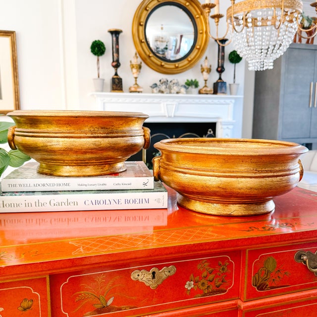 A pair of mid-century Italian centerpiece bowls featuring a classic footed silhouette and a heavy, textured gold leaf...