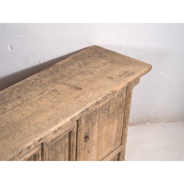 Antique low sideboard in elm wood, traditional Chinese furniture with distressed finish originating from Shanxi and dated...
