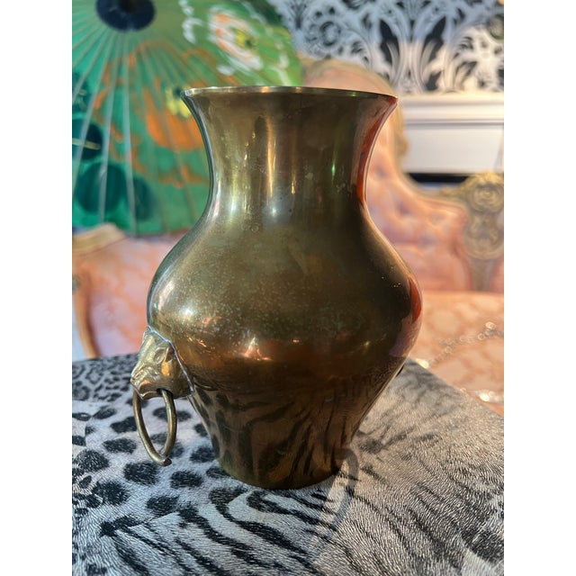 Up for consideration is a beautiful vintage small brass vase with lion head details. This would look lovely in your home...
