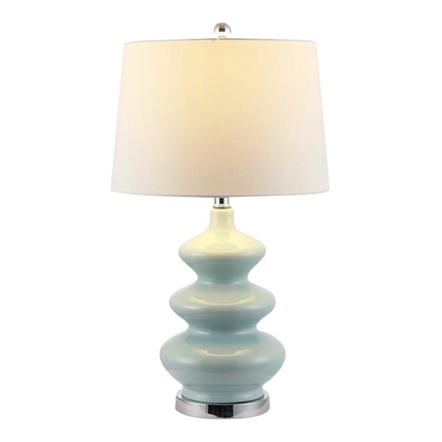 Ideal for heightening the decorative drama in clean-lined rooms, this Brielle Table Lamp undulates with a sense of depth...