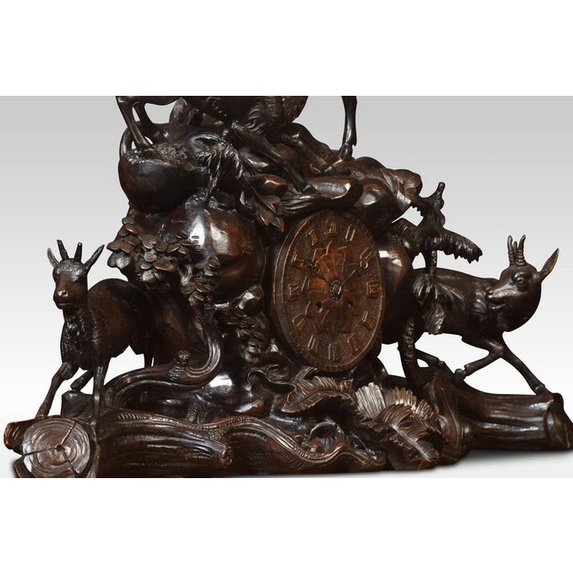 Rare 19th Century Black Forest’ carved wood three-piece clock set, the clock with 6ins carved wood dial to the French...