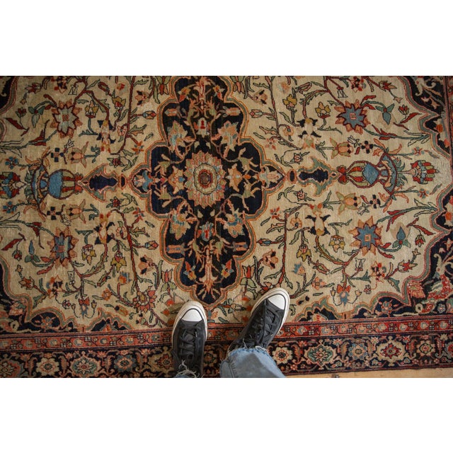 :: Horizontally elongated oversized scalloped center medallion with multi-tiered finials terminating in an outwardly...