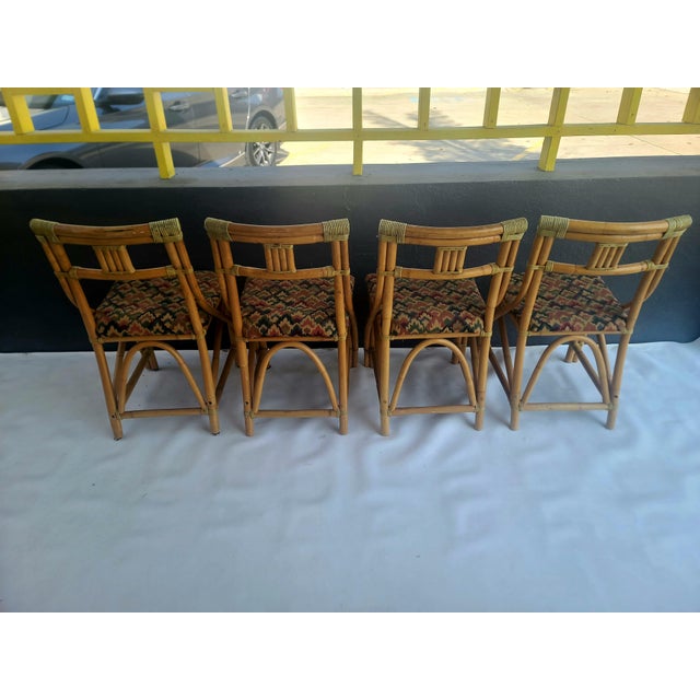 Set of 4 lovely Rattan dining/ patio chairs by LA Jolla Rattan Co. Matching table available in separate listing! Very...