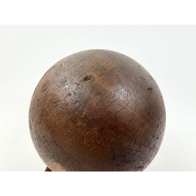 An original, antique bowling ball made of lignum vitae wood. Unlike traditional balls were never drilled for finger holes,...