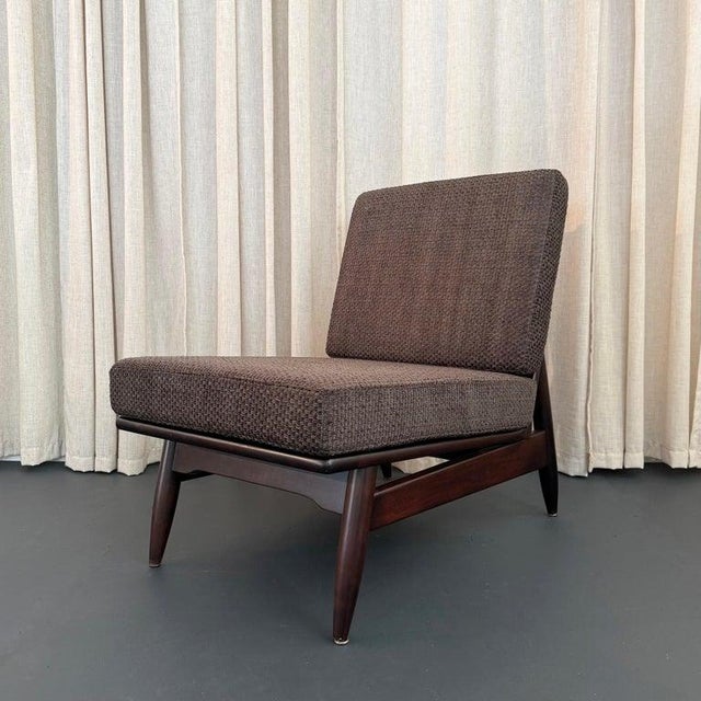This Scandinavian Modern slipper lounge chair boasts wonderful proportions and detailing. The low armless frame features a...