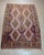 Vintage handwoven Turkish kilim rug featuring a beautifully balanced geometric composition in a soft, time-worn palette....