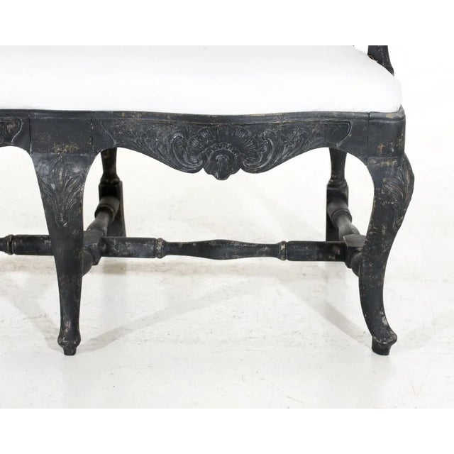 This beautiful three seat sofa-bench was crafted in sweden over 100 years ago in the classic rococo style. It features...