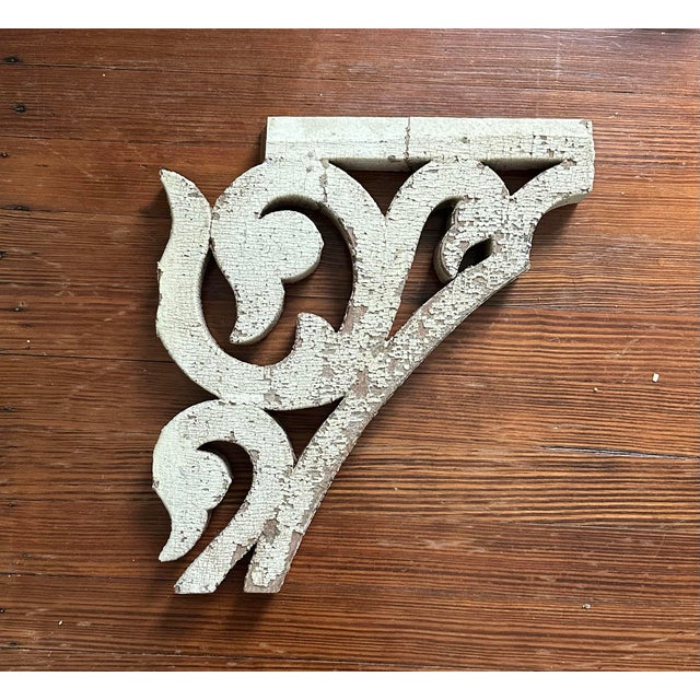 A gorgeous, antique wood corbel fragment. Features a scrolled, swan head bracket detail with a distressed finish in...