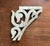 A gorgeous, antique wood corbel fragment. Features a scrolled, swan head bracket detail with a distressed finish in...