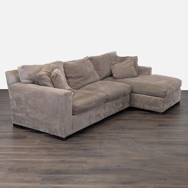 This Crate & Barrel sectional features a soft microfiber fabric and a spacious chaise for extra comfort. Comes with...