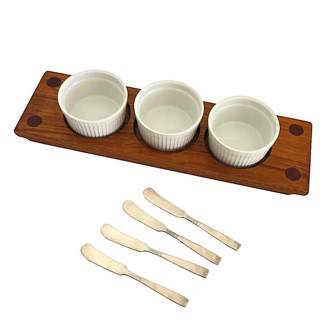 Offered is a vintage teak wood board with 3 round carveouts. We've paired it with 3 ceramic ramekins and 4 vintage silver...