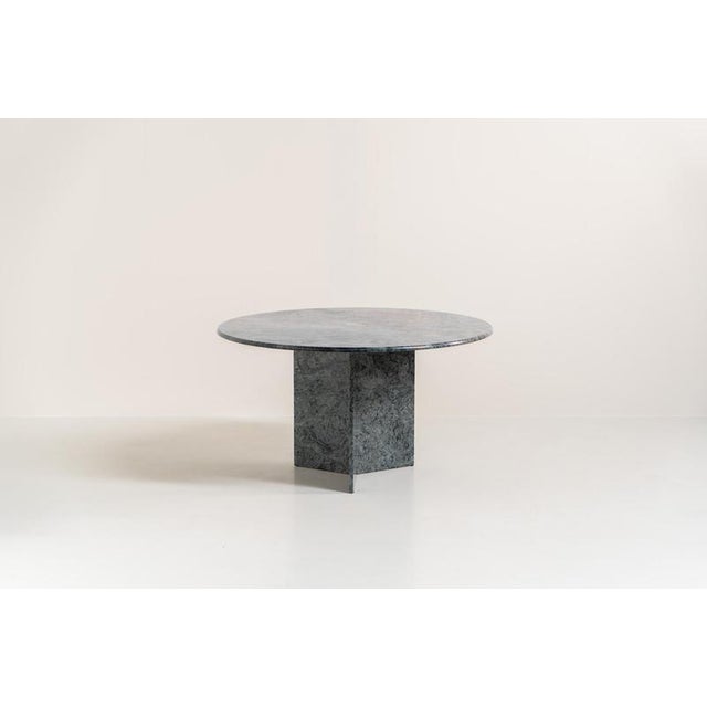 Striking dining table in solid Juparana Granite (Italy, 1970s). A beautifully sculptural piece, crafted entirely from...