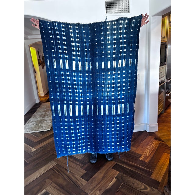 This lovely Malian mud cloth is hand-woven cotton dyed with plant based indigo fermented mud and washed to reveal an...