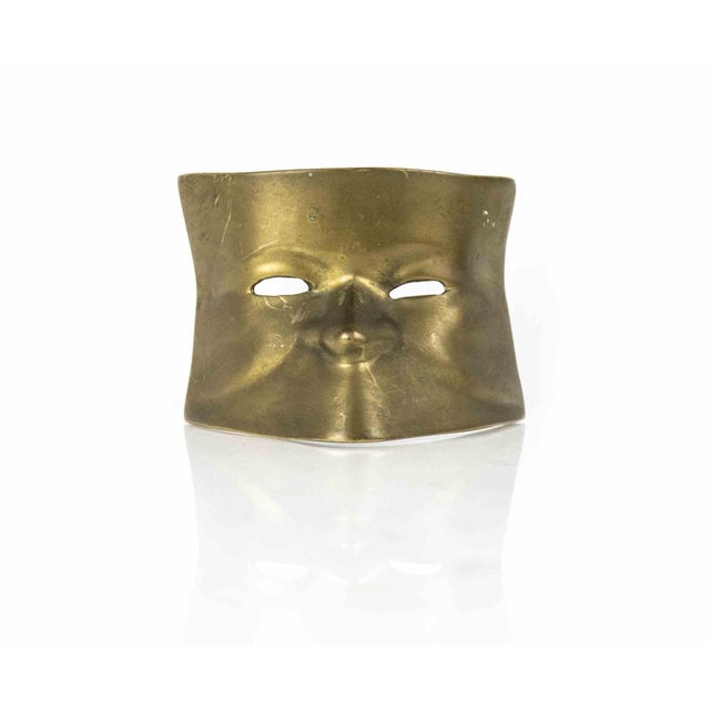 Brass mask is an original decorative object realized in the half of the 20th century. A unique brass object depicting a...