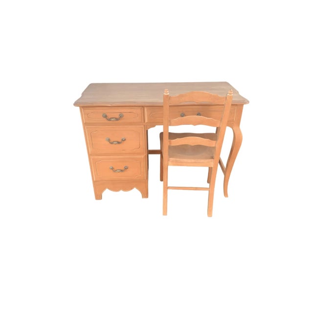 This vintage Ethan Allen desk and chair set boasts timeless French country style. The desk features four drawers for ample...