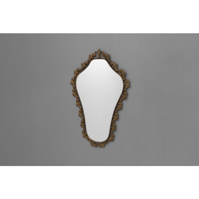 Mid-Century brass framed mirror with original glass. France circa 1950.