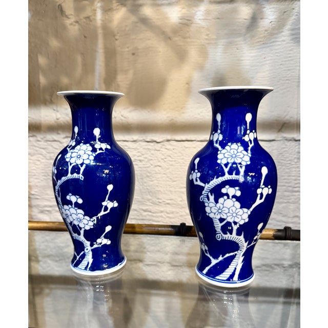 This is a charming pair of smaller Late Chinese Export Vases in cobalt decorated with the traditional prunus branch...