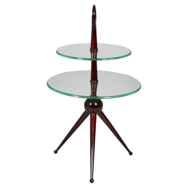 Delightful wooden tripod side table with a double circular top in cut glass, the upper one having a smaller diameter. By...