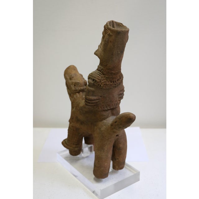 Exceptional antique African Tribal Art terracotta sculpture representing a rider on his horse. It dates back from the 14th...