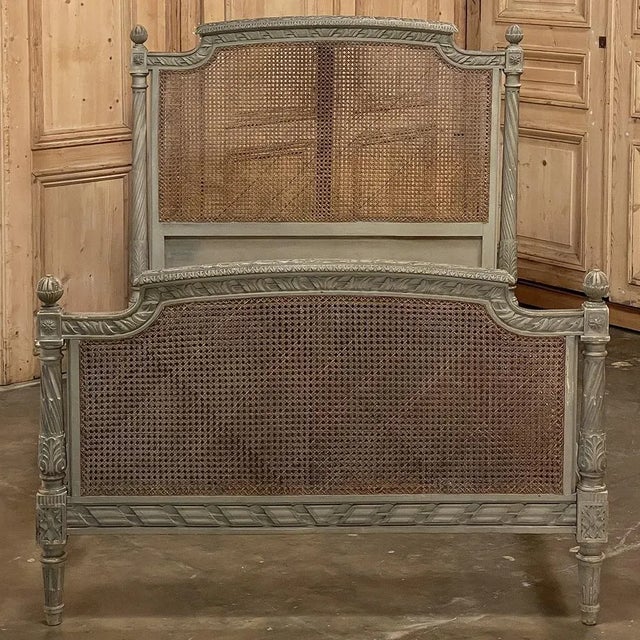 19th Century French Louis XVI Painted Bed with Caning is a splendid example of what some have called 'Paris Country' where...