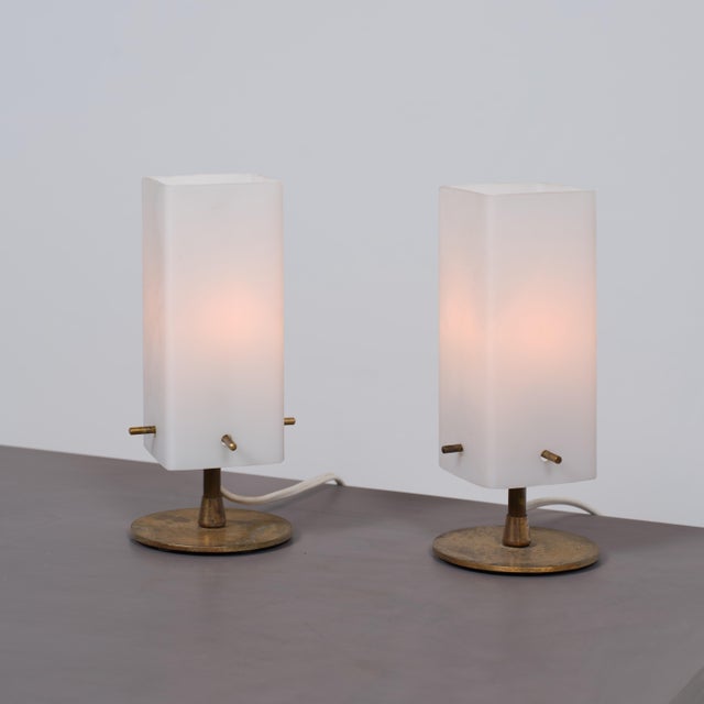 Pair of italian table lamps from the 1950s, featuring solid brass bases and tall rectangular shades in white opaline...