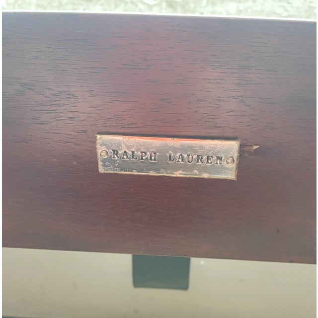 Queen Bed by Ralph Lauren. Store item # 358. It features solid mahogany wood and comes with slats.