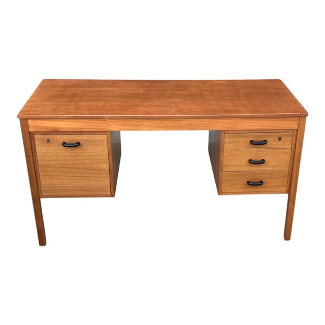 A beautifully restored mid-century Danish modern desk showcasing clean architectural lines and timeless functionality....