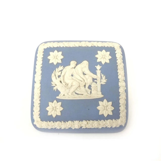 This Wedgwood jasperware soft dusty blue & white square trinket box is a collectible piece originating from the United...