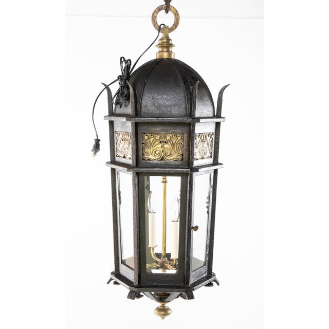 Baroque style wrought iron and bronze hanging lantern with distinctive bronze decorative plaques and original chain and...