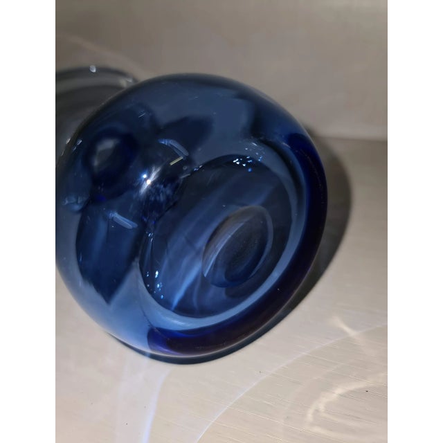 Sanded on the base. Light blue.