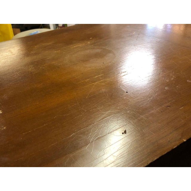 This is a premium service piece, featuring a specialized felt-lined drawer with dividers for silverware and a vast, fixed...