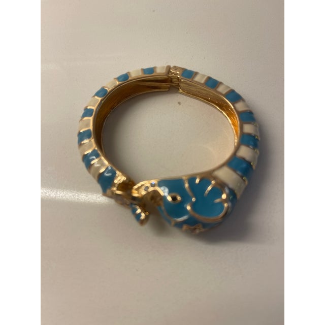 great braclet -LATCH OPENING OF ENAMEL ELEPHANT HEAD BRACLET IN TURQ/WHITE,FITS AVERAGE WRIST