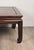 A late 19th-century Chinese Kang table in the Ming style in mu wood.