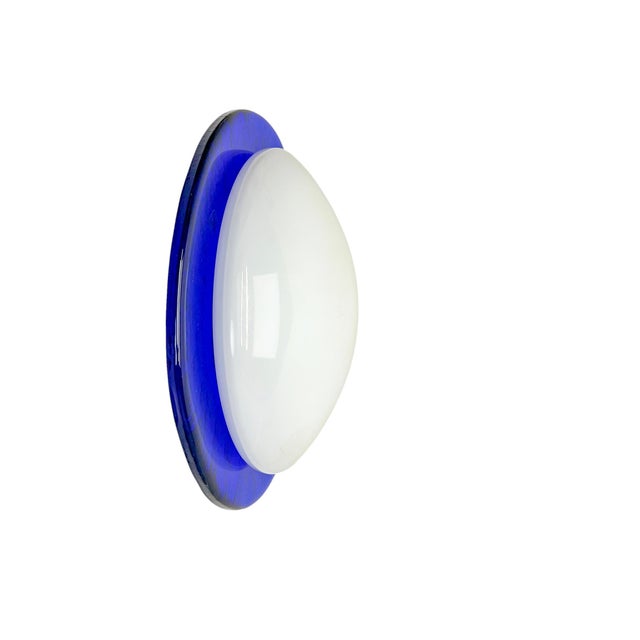 Mount blown round wall or ceiling light in embossed blue and white Murano Glass, Italy 1970s-1980s. Full of character and...