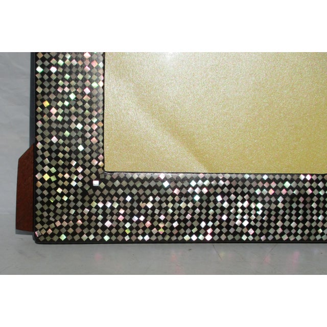Vintage 70s' frame of Mother of Pearl shell mosaic inlay in black matrix with a lacquered finish. The surface is made on...