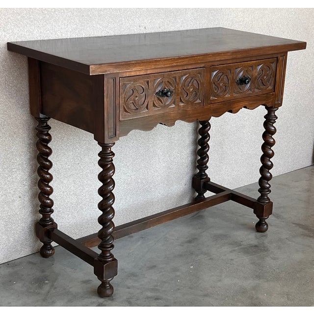 Early 20th century carved Spanish console with turned legs and a drawer with hardware This table with character is of rare...