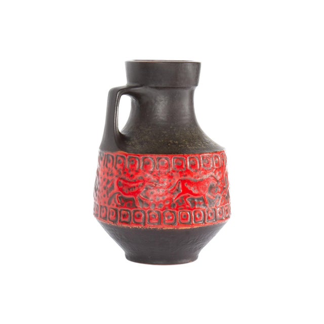 A West German jug or vase produced by Carstens Tönnieshof. This mid-century vase features the Carstens "Prehistoric"...
