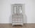 An exceptional early 19th-century Swedish secretary cupboard, circa 1810–1830, finished in soft grey with a beautifully...