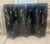 A vintage 20th Century Chinese black-lacquer six-panel folding screen, hand-painted with a traditional garden courtyard...