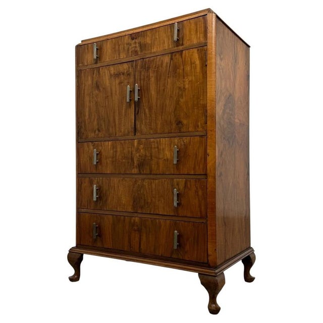 A beautifully crafted 20th-century figured walnut cupboard, combining generous practical storage, elegant traditional...
